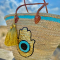 Boho rattan beach bag Hamsa Marrakech, with Hamsa hand and gold tassel