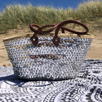 Large straw beach bag with sequins silver, in the dunes