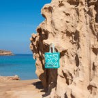 Ibiza beach bag Laguna blue, on a rock with a sea view