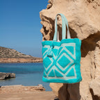 Ibiza beach bag Laguna blue, front view in the sun