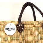 Rieten shopper Faria, detail van de leren hengsels en het Bohemida label