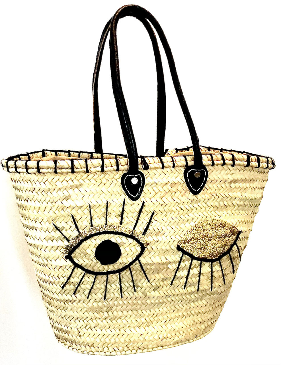 Rieten strandtas met pailletten Eyes, op een witte achtergrond