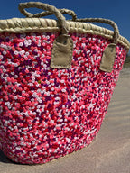 Straw beach bag with sequins pink, red and white, close up of the sequins
