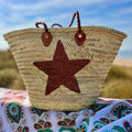 Straw beach bag with sequins Star brown, on the beach