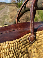 Rattan bag Faria with leather closure, close up of the weave and leather trim