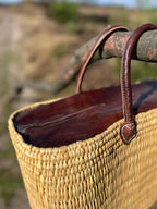 Rattan bag Faria with leather closure, detail of the leather handles
