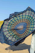 XXL beach towel Blue Paradise billowing in the wind on the beach