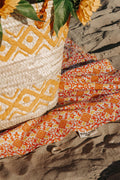 XXL beach towel Yellow Orange Ombre in the sand with a rattan bag full of sunflowers