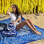 XXL beach towel Star Blue 235x220 cm, with a woman and rattan bag on the beach