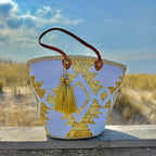 Boho rattan beach bag Aztec white and gold, front view in the dunes